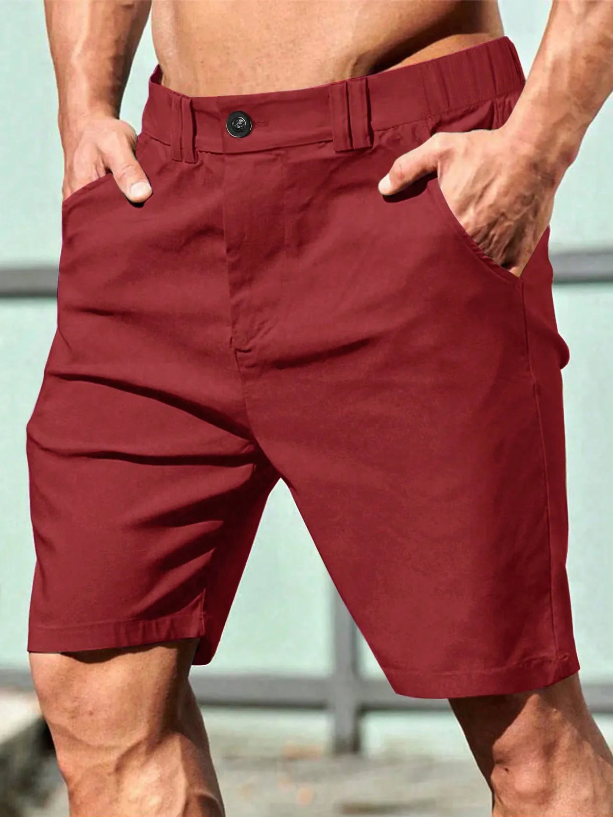 Bermuda masculina de cor sólida com bolsos